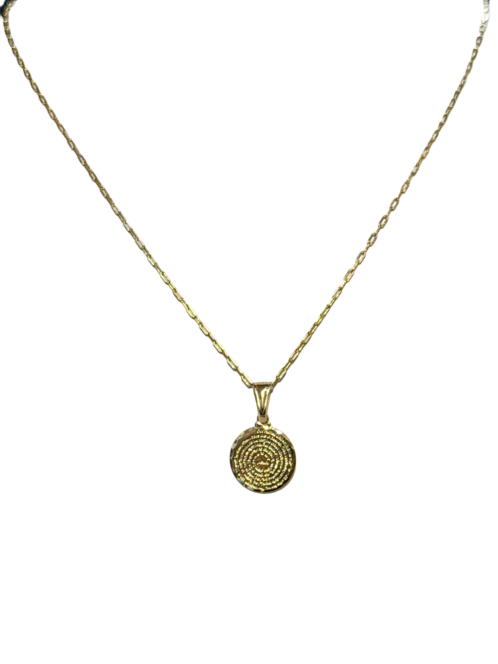 Gold necklace with a circular pendant on a mannequin bust.